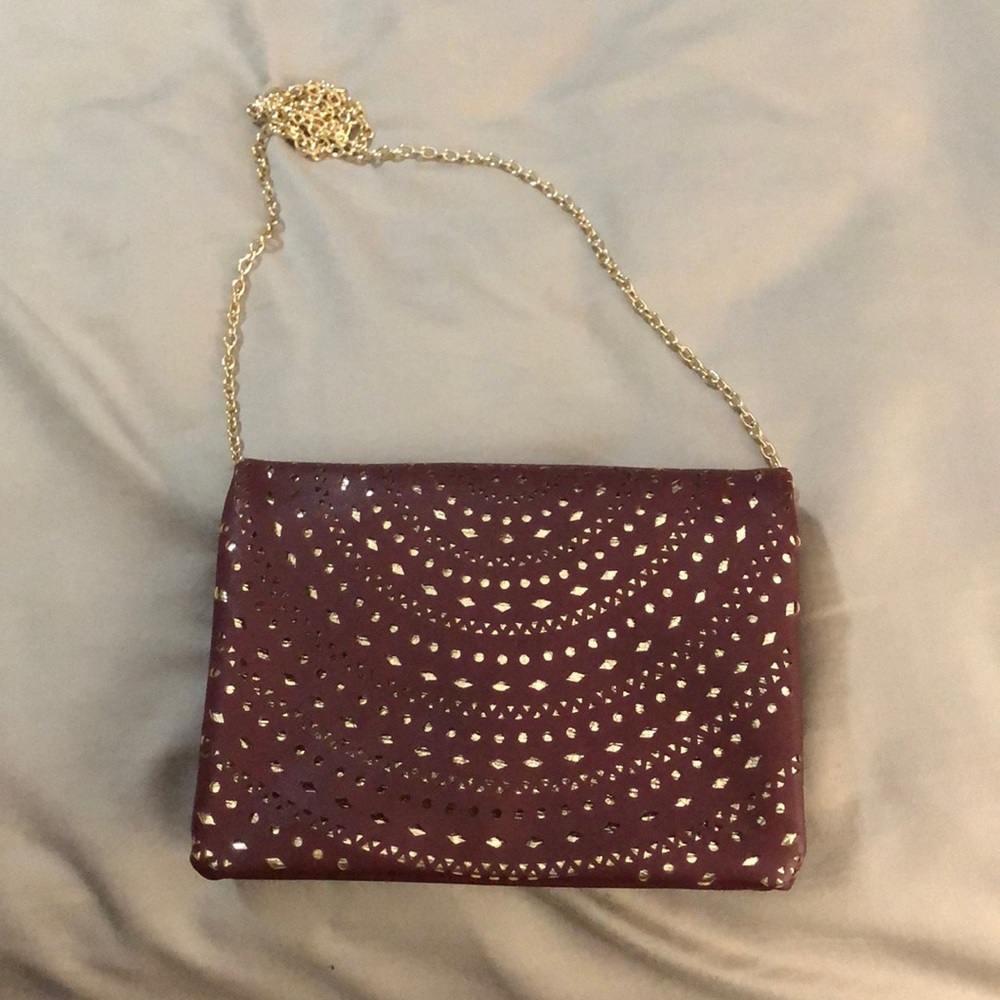 Maroon and gold crossbody clutch